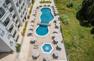 an overhead view of a pool with chairs and umbrellas at Apartment AS in Ulcinj