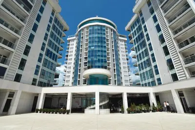 a large building with two tall buildings at PREMIUM Tre canne apart 