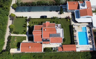 an overhead view of a house with red roof at Residence LEORA in Ulcinj