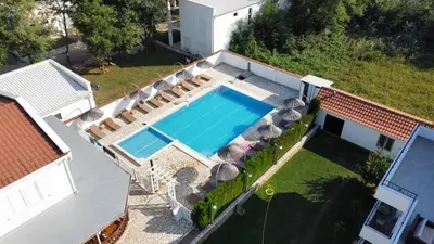 an overhead view of a swimming pool on a house at Residence LEORA in Ulcinj