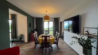 a dining room with a table and chairs at Villa Concordia in Budva