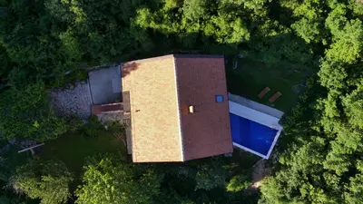 an overhead view of a building with a pool at Villa Concordia in Budva