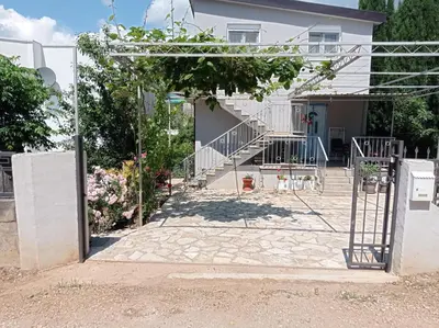 a house with a gate and stairs in front of it at Olga 112 in Bar