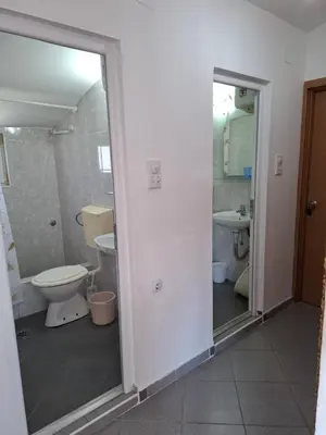 a bathroom with a toilet and a sink at Aleksandrija in Čanj
