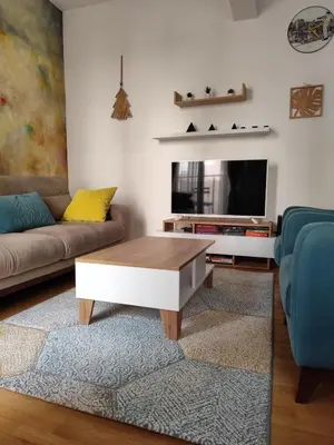 a living room with a couch and a coffee table at Kan in Podgorica