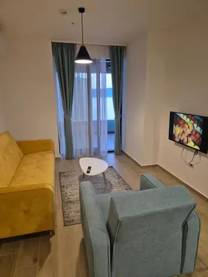 a living room with a couch and a table at Rafailovici Beachfront Apartment 2 in Budva