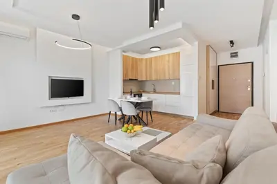 a living room with a couch and a table at ID LUX APARTMENTS in Becici