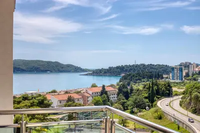 a view of the water from a balcony at ID LUX APARTMENTS in Becici