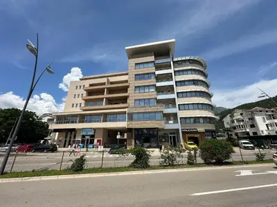 a large building on the side of a street at The Budva Apartment in Budva