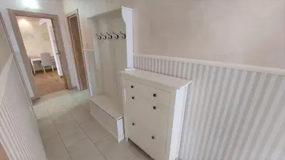 a white room with a dresser and a hallway at Sea view steps to Przno beach 2 Bedrooms Terrace Parking Villa Olive in Sveti Stefan