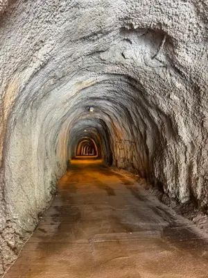 a tunnel with a long road in a cave at Sea view steps to Przno beach 2 Bedrooms Terrace Parking Villa Olive in Sveti Stefan