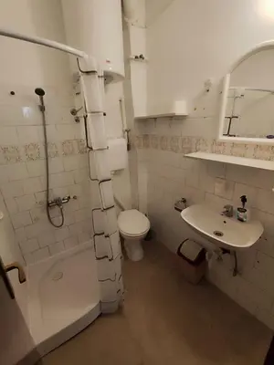 a bathroom with a toilet and a sink at Apartmani Vučević in Sutomore