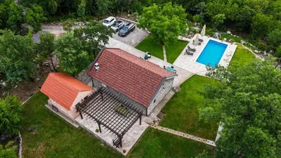 an overhead view of a house with a swimming pool at Holiday home Zlatna Glavica in Podgorica
