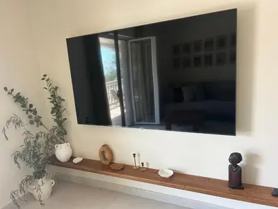 a large mirror on a wall above a sink at Steps to beach 3 Bedrooms 2 Bathrooms 2 Kitchens with a Terrace - 2 Parking spots - Sea View in Sveti Stefan