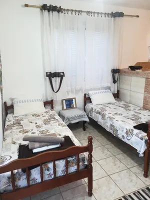 a bedroom with two beds and a window at Montenegrinbeautystar in Bar
