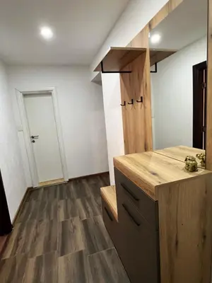 a kitchen with a wooden counter and a door at Agatom in Budva