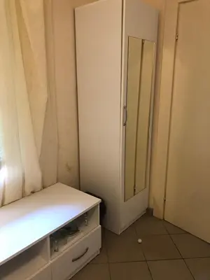 a small room with a mirror and a cabinet at Apartmani Marina in Sutomore