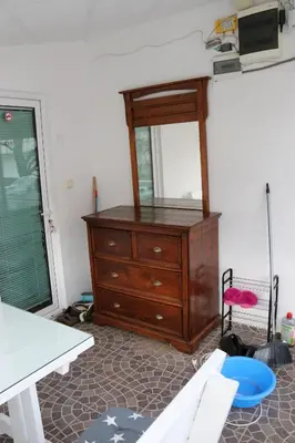 a room with a dresser and a mirror at Smještaj Milena Čanj in Čanj