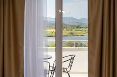 a view of a balcony with a table and chairs at GAVIA Apartments - Ulcinj in Ulcinj