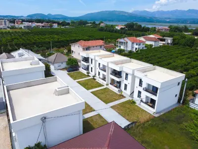 an aerial view of a row of white buildings at Bumax Apartments in Ulcinj