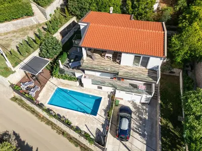 an overhead view of a house with a swimming pool at Villa DanDan Sutomore in Zagrađe