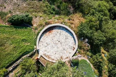 an aerial view of an old brick building on a hill at Boutique hotel Ruzmarin SPA & Garden by Aycon in Budva