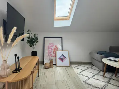 a living room with a table and a couch at SunJourney Apartment SEA view in Becici