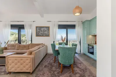 a living room with a couch and a table at Family House Giardino Verde in Bar