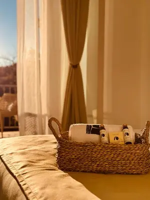 a basket sitting on top of a bed at Most Oliva Resort Budva in Budva