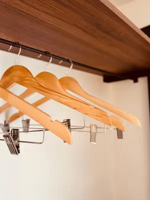 a group of wooden skis hanging from a shelf at Most Oliva Resort Budva in Budva