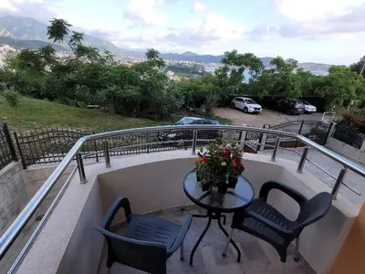 a table and two chairs on a balcony with a view at Montenegro Apartments Phoenix With Pool in Bar