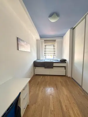 a bedroom with a bed and a window at Charming Stay in Budva Center with Parking in Budva
