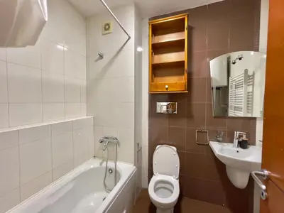 a bathroom with a toilet and a sink at Heart of the City Stunning comfort,Balcony ,Netflix,Free Wi-Fi in Podgorica