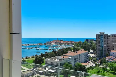 a view of the harbor from the balcony of a building at Apartman Drobnjak Center-sea View in Budva