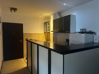 a kitchen with a black counter top in a room at Mik Apartments Heart of Budva 1 plus 1 40 SqMeter in Budva