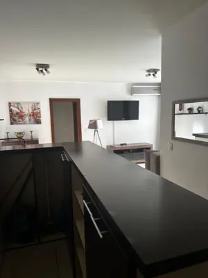 a kitchen with a black counter top in a room at Mik Apartments Heart of Budva 1 plus 1 40 SqMeter in Budva