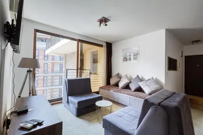 a living room with a couch and a chair at Mik Apartments Heart of Budva 1 plus 1 40 SqMeter in Budva