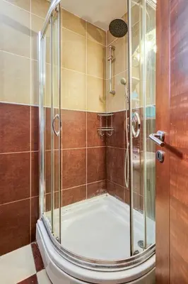 a shower with a glass door in a bathroom at Mik Apartments Heart of Budva 1 plus 1 40 SqMeter in Budva