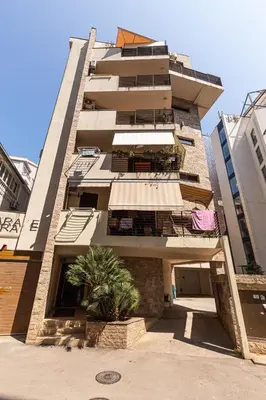 a tall building with balconies on the side of it at Mik Apartments Heart of Budva 1 plus 1 40 SqMeter in Budva