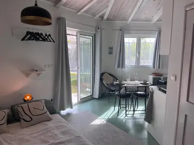 a room with a bed and a table and a kitchen at Sailors Home Stari Bar in Bar