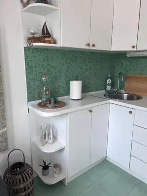 a kitchen with white cabinets and a sink at Sailors Home Stari Bar in Bar