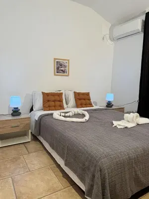 a bedroom with two beds and a couch at Villa Happy Family!!! in Prijevor