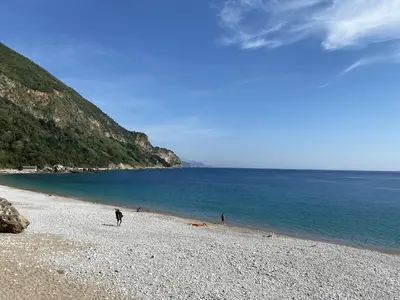 a group of people on a beach near the water at Villa Happy Family!!! in Prijevor