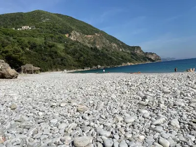 a large pile of rocks on a beach at Villa Happy Family!!! in Prijevor