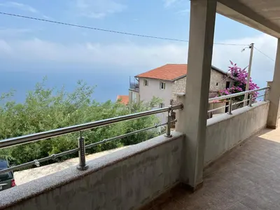 a balcony with a view of a house at Villa Happy Family!!! in Prijevor