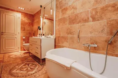 a bathroom with a tub and a sink and a toilet at The Unique Splendid Conference Spa Resort Family apt suite sleeps 6 in Becici