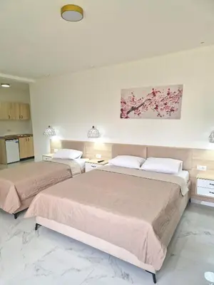 two beds in a hotel room with two beds at IVANA Apartments in Ulcinj