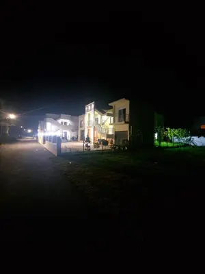 a group of houses at night with lights at IVANA Apartments in Ulcinj