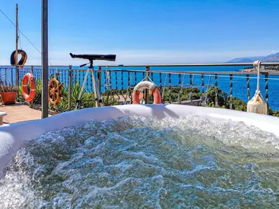 a jacuzzi tub with a view of the water at Apartment Carpe Diem with the best sea view, Utjeha Montenegro Mediterranean Eu in Masline