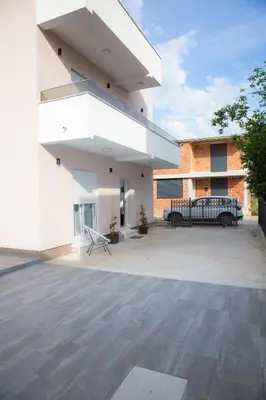 a large patio with a bench in front of a building at TWINS DREAMs HOUSE in Bar